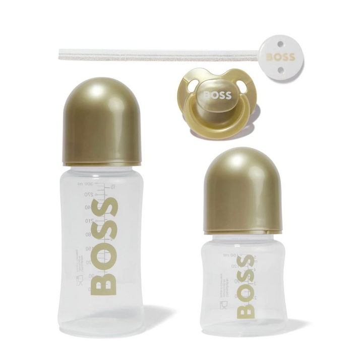 Set de biberones y chupón BOSS para bebé en dorado