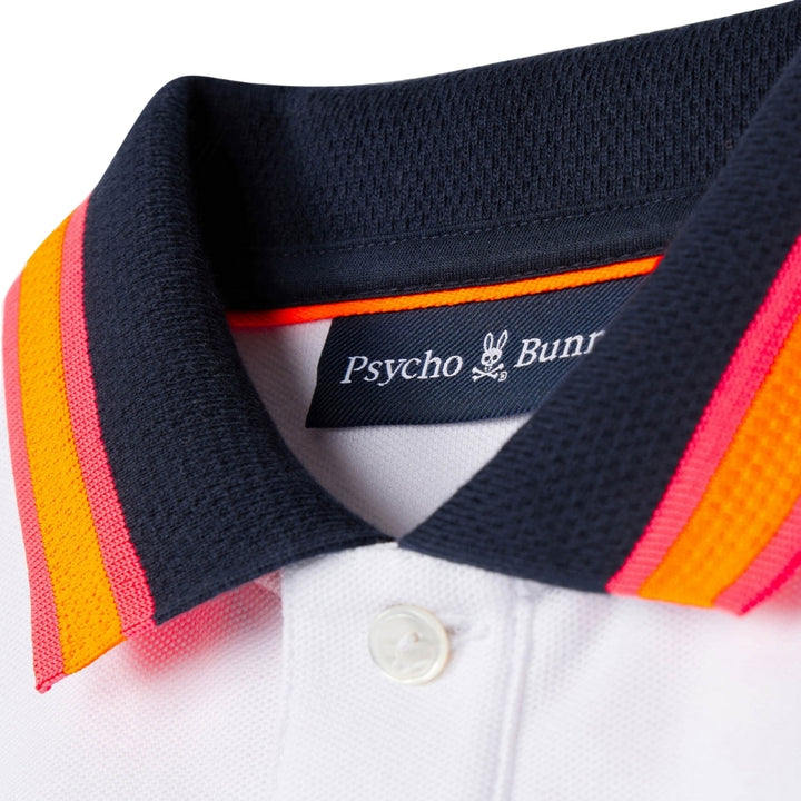 Psycho Bunny polo blanco con bordado y detalles en cuello y mangas en tonos naranja y rosa